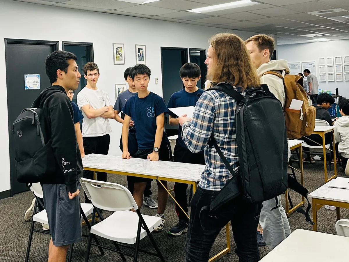 Students talking together between competition activities